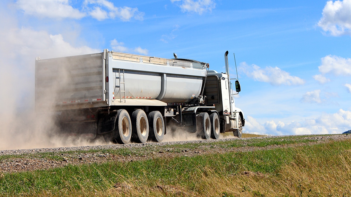 Vibration for dump truck and trailer unloading